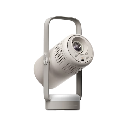 A modern, minimalist portable projector with a sleek cylindrical body, perforated vent details, and a sturdy handle, shown in a light gray color on a solid white background.
