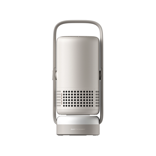 A sleek, modern portable lamp or projector with a matte light gray body, a matching gray handle, and a circular vent grille on the lower half, shown against a solid white background.