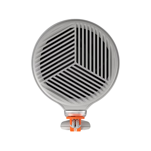 A sleek, cylindrical smart projector in metallic silver with a textured mesh grille on the lower half and a small orange power button on the front, isolated on a white background.