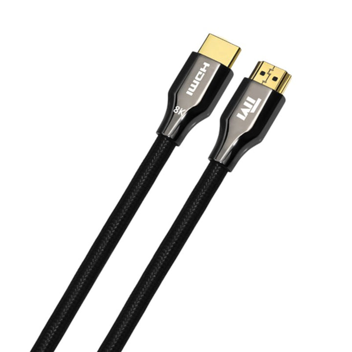 A black braided HDMI 8K cable with gold-plated connectors, coiled on a white background. The left connector shows the HDMI logo and '8K' text, and the right connector shows a stylized 'TM' logo.