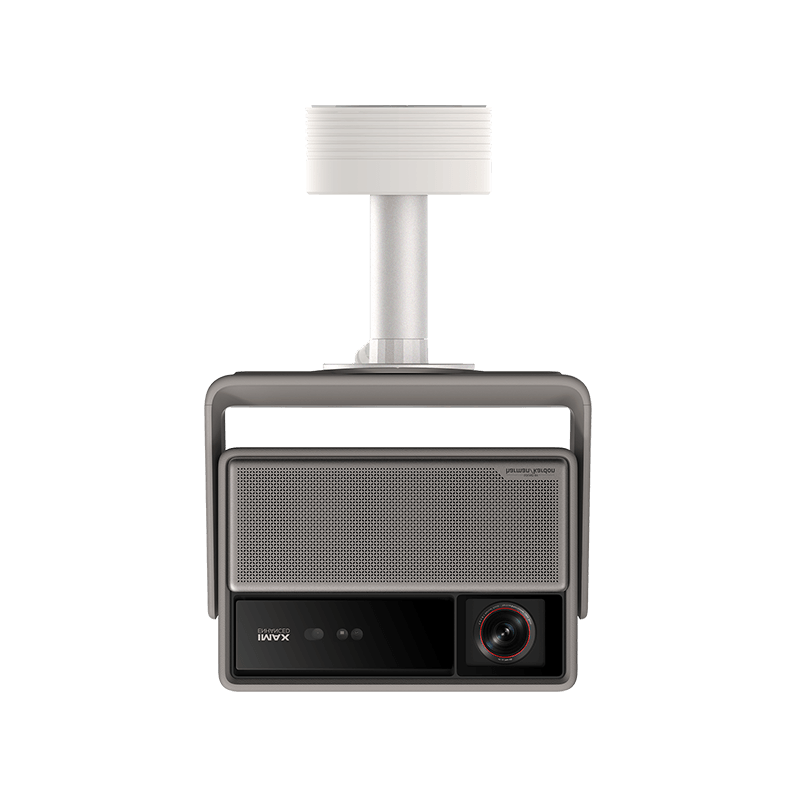 A modern wall-mounted projector and speaker combo by iAVX, featuring a gray housing, a white ceiling mount arm, and a black front panel with a lens and control buttons.
